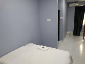 Postel nebo postele na pokoji v ubytování Qeyjan Hotel