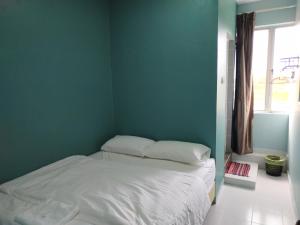 Postel nebo postele na pokoji v ubytování Qeyjan Hotel