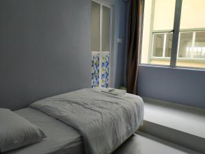 Postel nebo postele na pokoji v ubytování Qeyjan Hotel