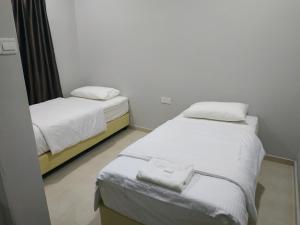 Postel nebo postele na pokoji v ubytování Qeyjan Hotel