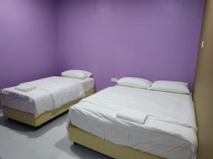 Postel nebo postele na pokoji v ubytování Qeyjan Hotel