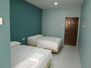 Postel nebo postele na pokoji v ubytování Qeyjan Hotel + 20 fotografií