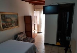 Postel nebo postele na pokoji v ubytování Hotel Tiumara Cartago