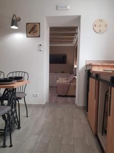 a kitchen and dining room with a table and chairs at LISA HOUSE in Catania
