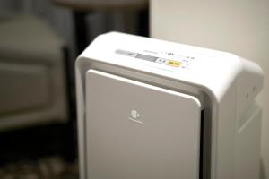 a close up of a white refrigerator at Sotetsu Fresa Inn Kanda-Otemachi in Tokyo