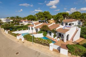 an aerial view of a house with a swimming pool at Duna Villa, Cala Blanca in Cala Blanca