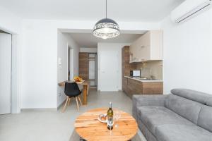 a living room with a couch and a table at Villa Ancora in Rovinj