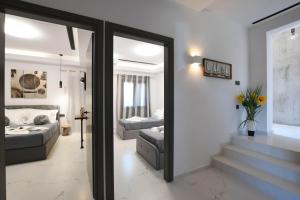 Postel nebo postele na pokoji v ubytování Orion Eco Suites