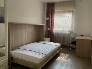 Ein Bett oder Betten in einem Zimmer der Unterkunft Ferienwohnung Brenderweg