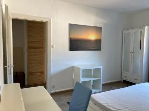 Ein Bett oder Betten in einem Zimmer der Unterkunft Ferienwohnung Brenderweg