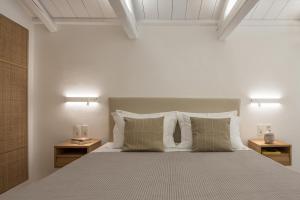 A bed or beds in a room at NESEA Boutique Apartments
