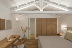 A bed or beds in a room at NESEA Boutique Apartments