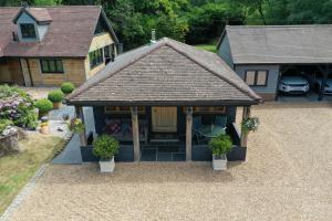 a model of a house with a garage at The Devils Cradle in Farnham