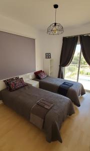 Ένα ή περισσότερα κρεβάτια σε δωμάτιο στο Villa Rossa