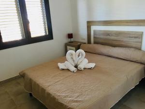 A bed or beds in a room at CASA RIBAS