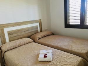 A bed or beds in a room at CASA RIBAS