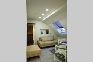 a living room with a couch and a table at HT Appartement Nr 1 in Greppin