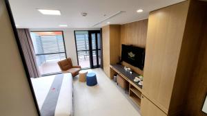 TV in/ali zabaviščno središče v nastanitvi Hotel Skypark DaejeonⅠ