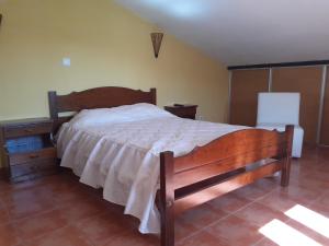 Una cama o camas en una habitación de Vila Sorriso