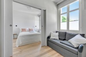 Posteľ alebo postele v izbe v ubytovaní Grand Apartments