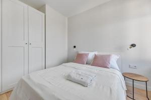 Posteľ alebo postele v izbe v ubytovaní Grand Apartments