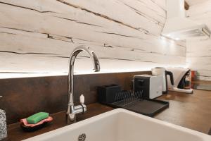 a kitchen counter with a sink and a sink at Lapmanni Holiday Home in Haapsalu