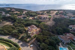 an aerial view of a house with the ocean at Sea & Villas in Stintino