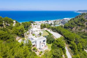 an aerial view of a house on a hill with the ocean at Ixian Hilltop Villa in Ialysos