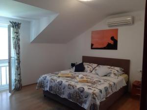 Postel nebo postele na pokoji v ubytování Apartments T & D