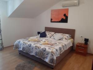 Postel nebo postele na pokoji v ubytování Apartments T & D