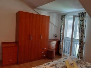 Postel nebo postele na pokoji v ubytování Apartments T & D