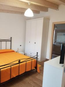 Un pat sau paturi într-o cameră la Casa vacanza centro Sardegna