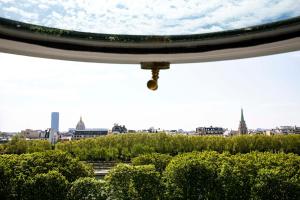 a view of the city from the roof of a building at Le Damantin Hôtel & Spa in Paris