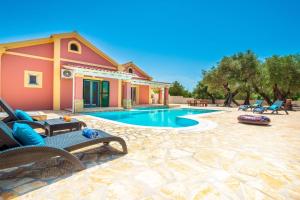 a house with a swimming pool in a yard at Beach Villa Joanna by PosarelliVillas in Acharavi