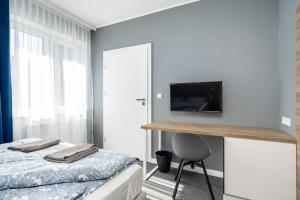Postel nebo postele na pokoji v ubytování Hugo