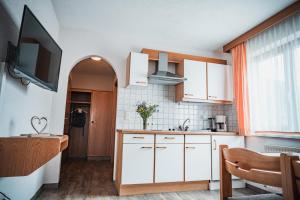 Kuchyň nebo kuchyňský kout v ubytování Hotel Garni Romantika