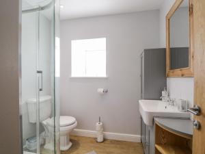 a bathroom with a toilet and a sink at Deer House in Oldshore