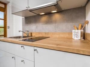 a kitchen with a sink and a counter top at Apartment Beni-1 by Interhome in Matulji