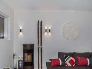 a living room with a couch and a fireplace at Holiday Home Levi hillside by Interhome in Levi +23 photos