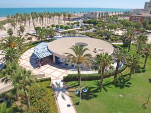 an aerial view of a park with palm trees at ApartUP Patacona Essence in Valencia