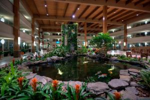 a pond in the middle of a building with koi at Crowne Plaza Suffern-Mahwah, an IHG Hotel in Suffern