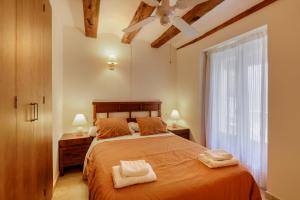 Postel nebo postele na pokoji v ubytování Apartamentos Casa Les Valeres