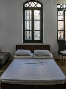Giường trong phòng chung tại Saidoff Luxury Residence