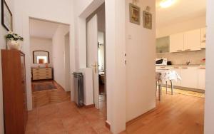 a living room with a kitchen and a dining room at Ondina in Rovinj