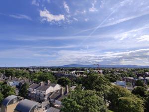 an aerial view of a city with buildings and trees at Clayton Hotel Burlington Road in Dublin