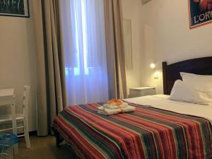 A bed or beds in a room at YooRoom
