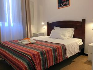 A bed or beds in a room at YooRoom
