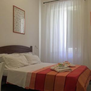 A bed or beds in a room at YooRoom