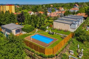 an aerial view of a house with a swimming pool at Penzion Jako Doma in Kyjov