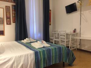 A bed or beds in a room at YooRoom